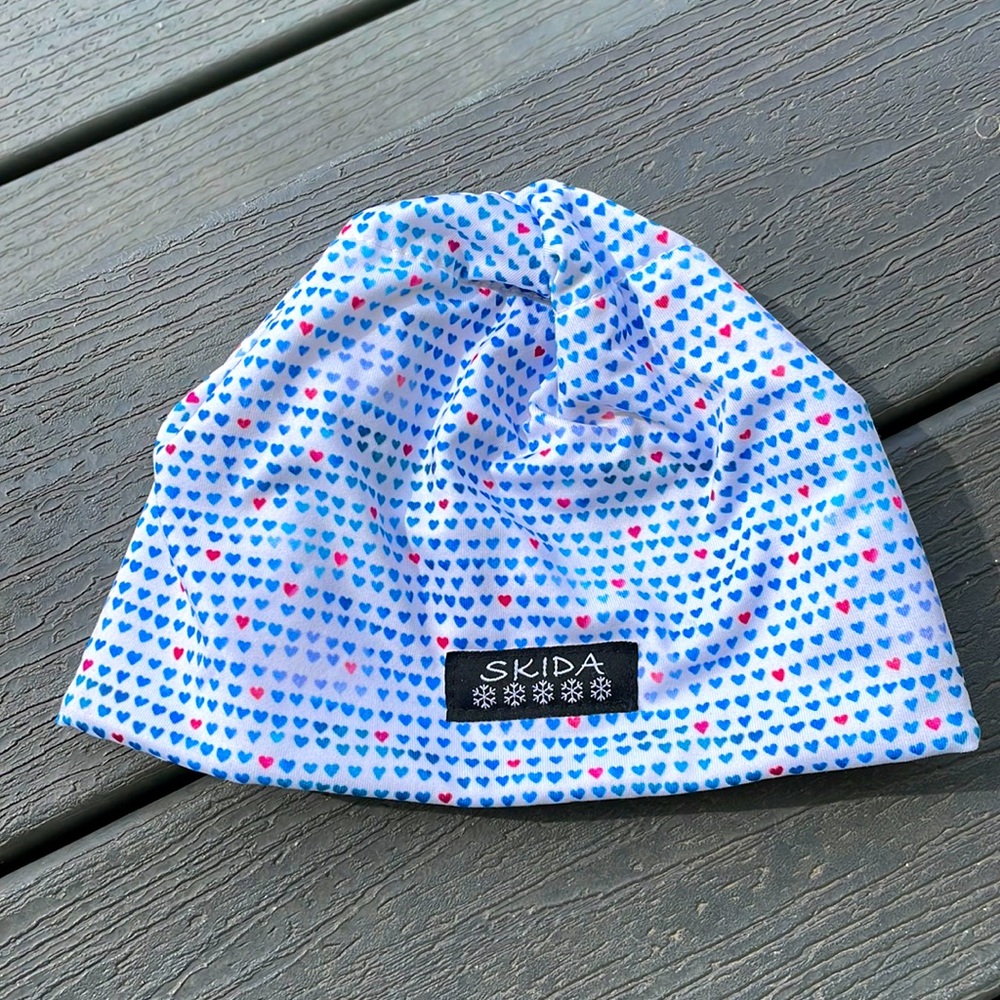Skida fleece lined hat. Kids. White with blue and red hearts
